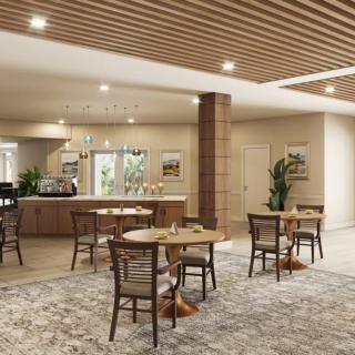 A spacious and inviting cafe interior with wooden furniture and modern decor.