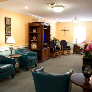 A cozy living room with comfortable seating and decorative elements.