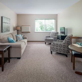 A cozy living room with comfortable seating and natural light.