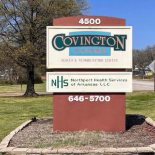 A sign for Covington Court Health and Rehabilitation Center and Northern Health Services of Arkansas located outdoors.
