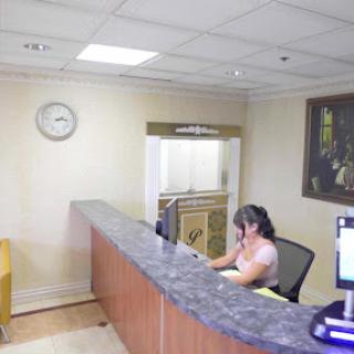 A receptionist busy at work in an office setting.