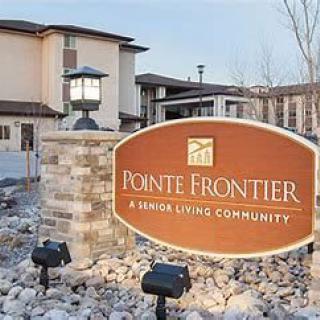 The entrance sign of Pointe Frontier, a senior living community.