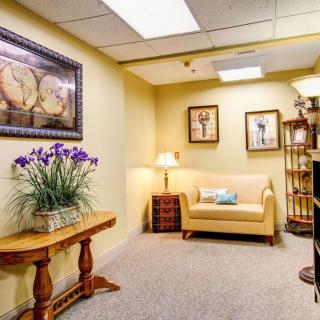 A cozy waiting room with comfortable seating and elegant decor.