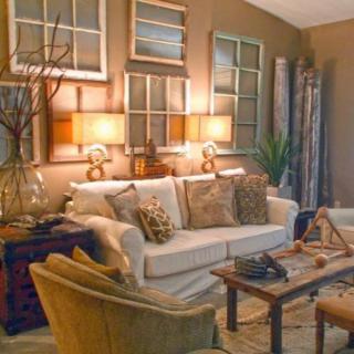 A cozy living room with vintage-style decor and warm lighting.