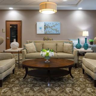 A well-decorated living room with comfortable seating and stylish decor.