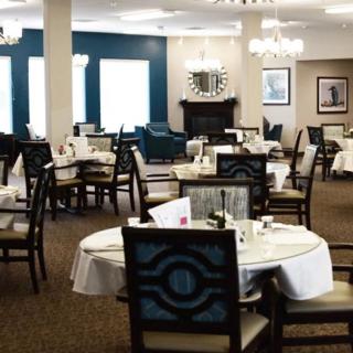 A well-appointed dining room with elegantly set tables and stylish decor.