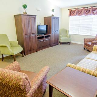 A cozy living room with comfortable seating and a television.
