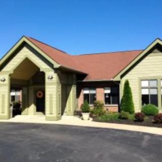 A well-maintained building with a welcoming entrance and landscaped surroundings.
