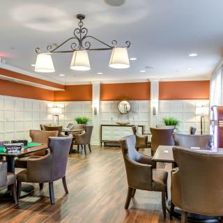 A well-lit dining area with elegant furniture and modern decor.