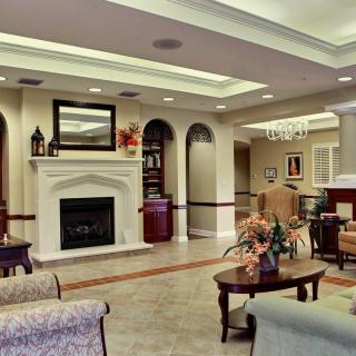 Elegant living room with a fireplace and comfortable seating.