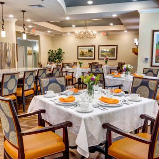 Elegant dining room with neatly arranged tables and stylish decor.