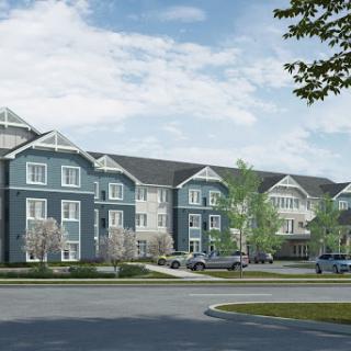 A modern residential apartment complex featuring contemporary architecture and well-maintained landscaping.