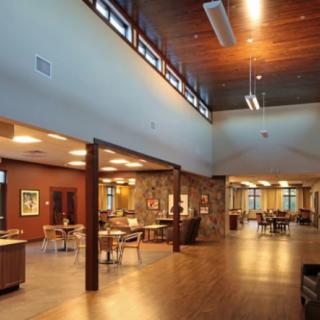 A modern lobby area featuring wood accents and comfortable seating.