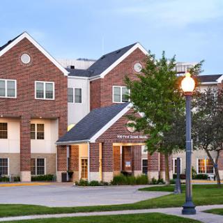 A charming residential building set against a serene evening sky.