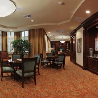 A cozy lounge area with seating and warm lighting.