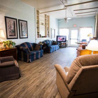 A cozy living room with comfortable seating and a television.