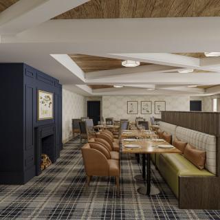 A modern and cozy restaurant interior featuring comfortable seating arrangements.