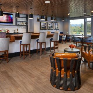 A modern bar with stylish seating and a cozy atmosphere.