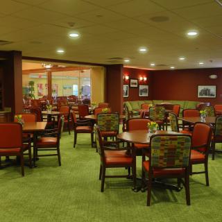 A cozy restaurant dining area with neatly arranged tables and chairs.