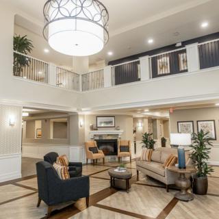 A spacious and elegantly designed lobby area with modern furnishings and decor.