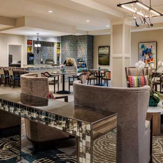 A modern open-plan living room with stylish furniture and elegant decor.