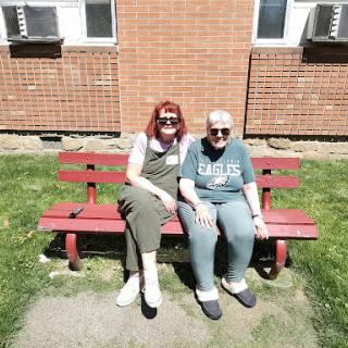 Enjoying a sunny day together on the bench.