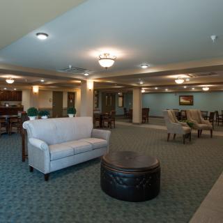 A spacious lobby with comfortable seating and elegant lighting fixtures.