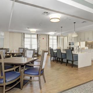 A modern dining area featuring elegant tables and chairs with contemporary lighting.