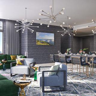 A spacious, modern living and dining area featuring stylish chandeliers, luxurious furniture, and elegant decor.