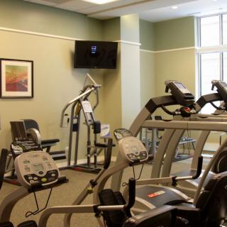 A modern gym equipped with treadmills and exercise machines.
