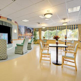 A spacious and inviting interior featuring comfortable seating and bright, natural light.