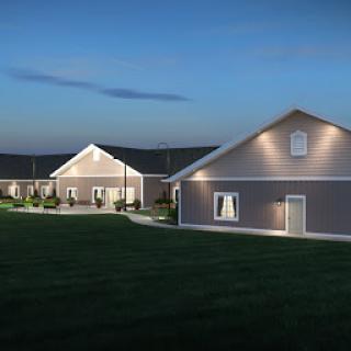 A beautifully illuminated residential property at dusk, showcasing modern architectural design.