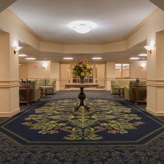 A spacious hotel lobby with elegant decor and comfortable seating arrangements.