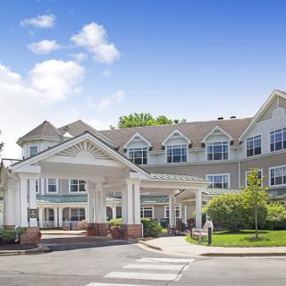 A large residential building with a welcoming entrance and well-maintained landscaping.