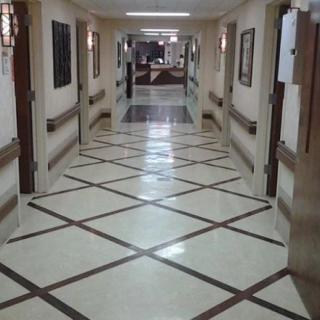 A long corridor with a geometric floor pattern.