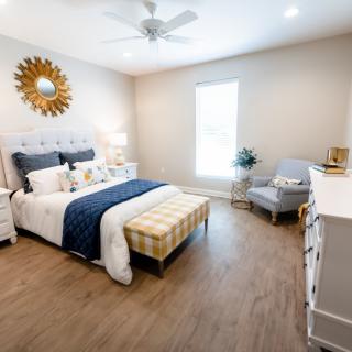 A modern and stylish bedroom with elegant furniture and decor.