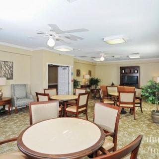 A cozy dining area with tables, chairs, and decor.