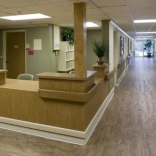 A view of a healthcare facility's reception and hallway area.