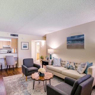 A cozy living room with a comfortable sofa, stylish chairs, and elegant decor.