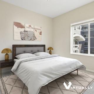 A modern bedroom with elegant furniture and decor.