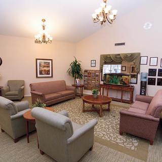 A cozy living room with comfortable seating and elegant decor.