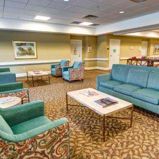 A spacious lobby with comfortable seating and a warm ambiance.