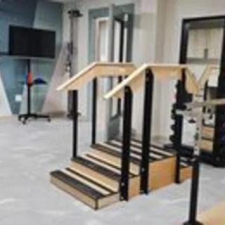 A rehabilitation facility with exercise stairs for physical therapy.