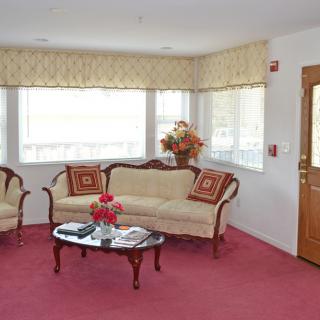 A cozy living room with classic furniture and warm decor.