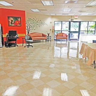 A spacious and inviting lobby area featuring comfortable seating and decorative elements.