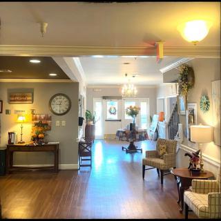 A cozy living space with comfortable seating and warm lighting.