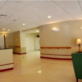 A well-lit interior hallway with modern lighting and furnishings.