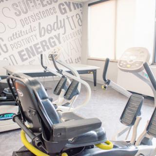 A well-equipped gym featuring various exercise machines for a great workout experience.