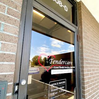 The entrance to Tendercare, showcasing a welcoming atmosphere with a reflection of the sky.
