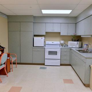 A kitchen with modern appliances and cabinetry.